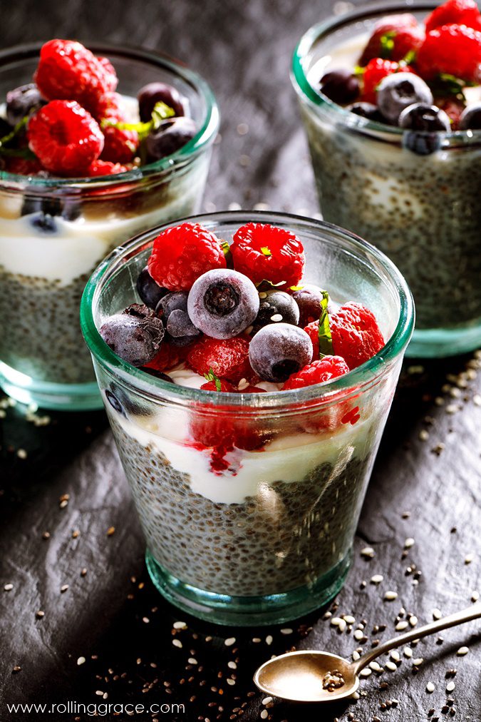 Glass jar of overnight chia pudding layered with fresh berries and chia seeds, one of the easiest ways to eat chia seeds