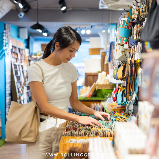 10 Proven Expert Solo Travel Tips for Asians 5 An Asian female solo traveller browsing products at a local shop with a tote bag, exploring independently
