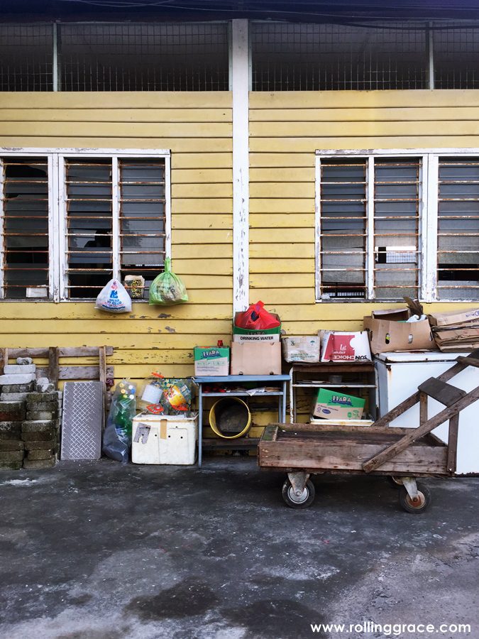 Yellow wooden stilt house on the riverside at Bagan Hailam fishing village, Port Klang, Selangor.