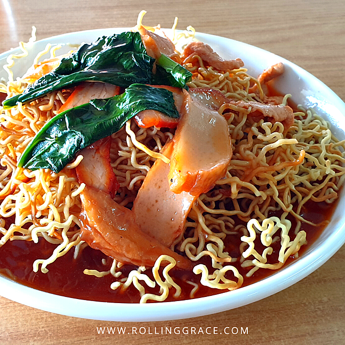 Fried crispy tomato mee in tomato broth with prawns and vegetables at Yee Ho Yan Cafe, Kuching, Sarawak