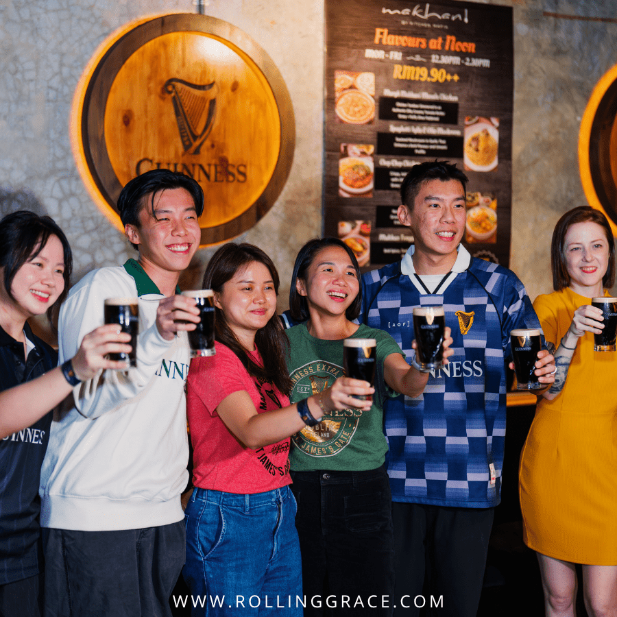 Group of people holding Guinness Draught pints at the Rate Your Pint launch event, Malaysia
