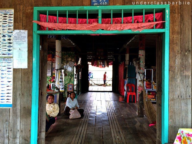 1-Day Kampong Khleang Itinerary: Best Attractions & Tips 14 Doorway of a home with red and green trim at Kampong Khleang, belonging to a family of Chinese descent, Cambodia.