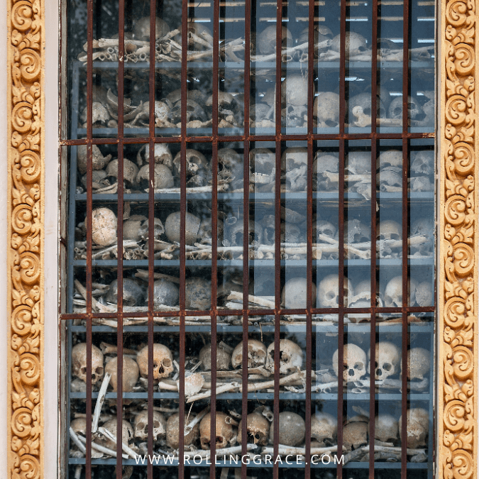 Human skulls behind glass inside the memorial stupa at Choeung Ek Genocidal Centre, Phnom Penh