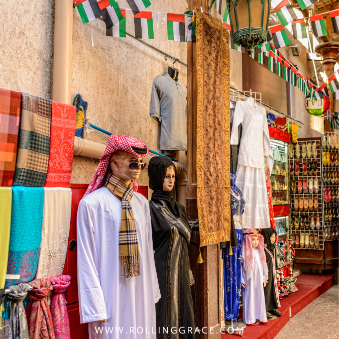 Traditional Emirati clothing and colourful fabrics on display at the Textile Souk in Bur Dubai.