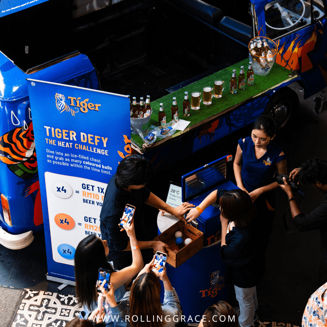 Tiger Beer Brewed to Defy the Heat: 6 Stops to Hit in KL 5 Tiger Beer promoters at the Brewed to Defy the Heat Kombi van ice challenge stop in Klang Valley, Malaysia.