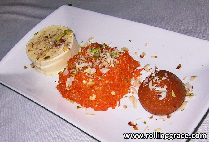 Trio of dessert with gulab jamun, badami kulfi and ghajar halwa on a white plate at Tandoor Grill Ipoh, Perak.
