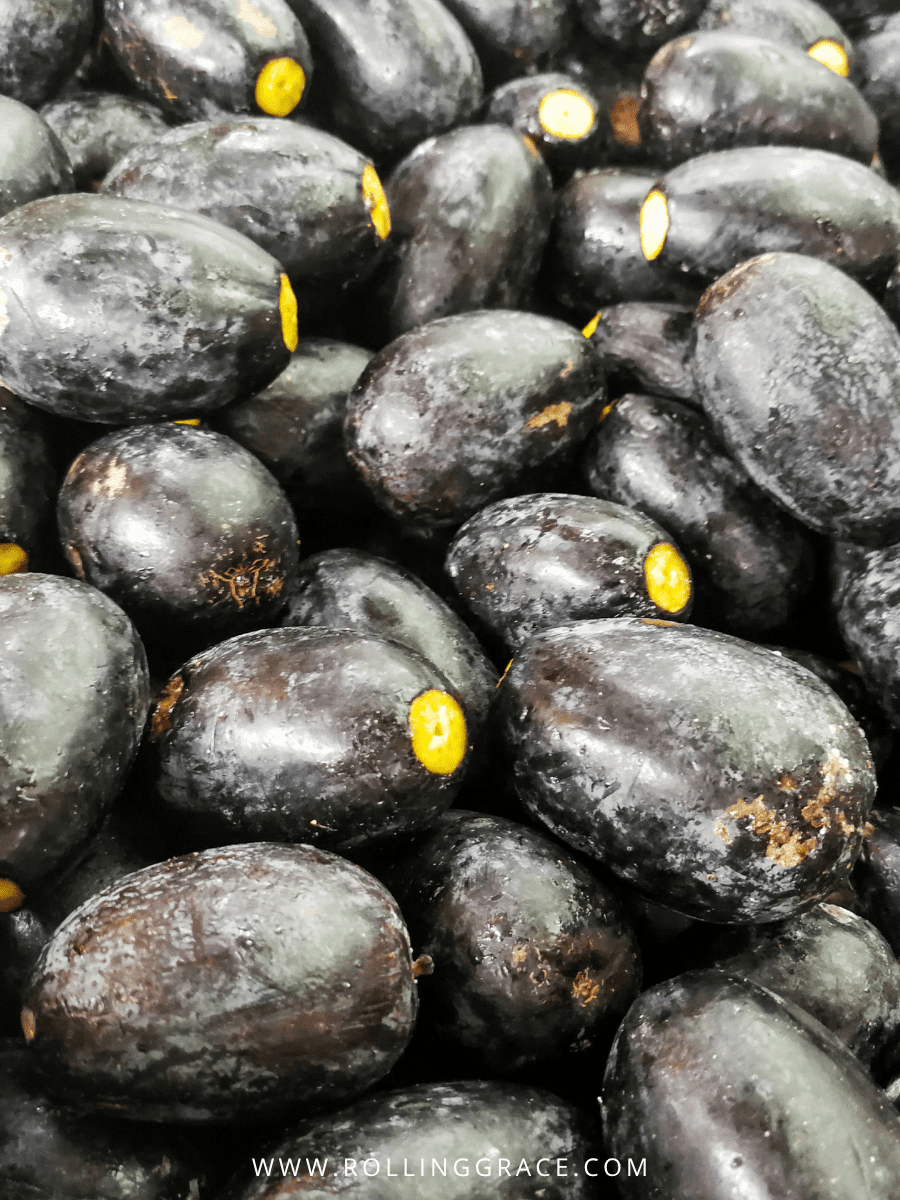 Best Sarawak Food: 20 Must-Try Traditional Dishes Guide 14 Buah Dabai black olive native to the Rajang River basin of Sarawak displayed at a local market
