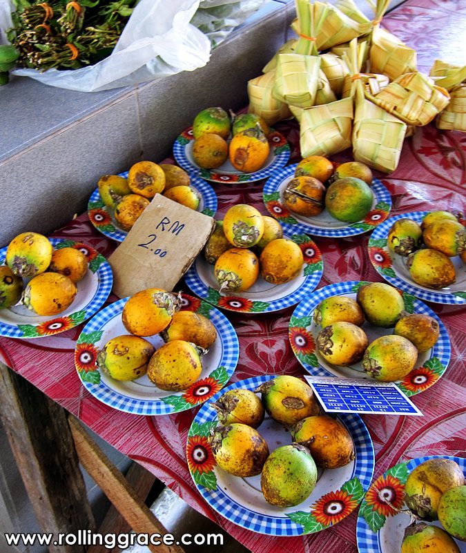 Best Sarawak Food: 20 Must-Try Traditional Dishes Guide 13 Terung Dayak terung asam yellow Borneo eggplants sold at a Sarawak market in Kuching