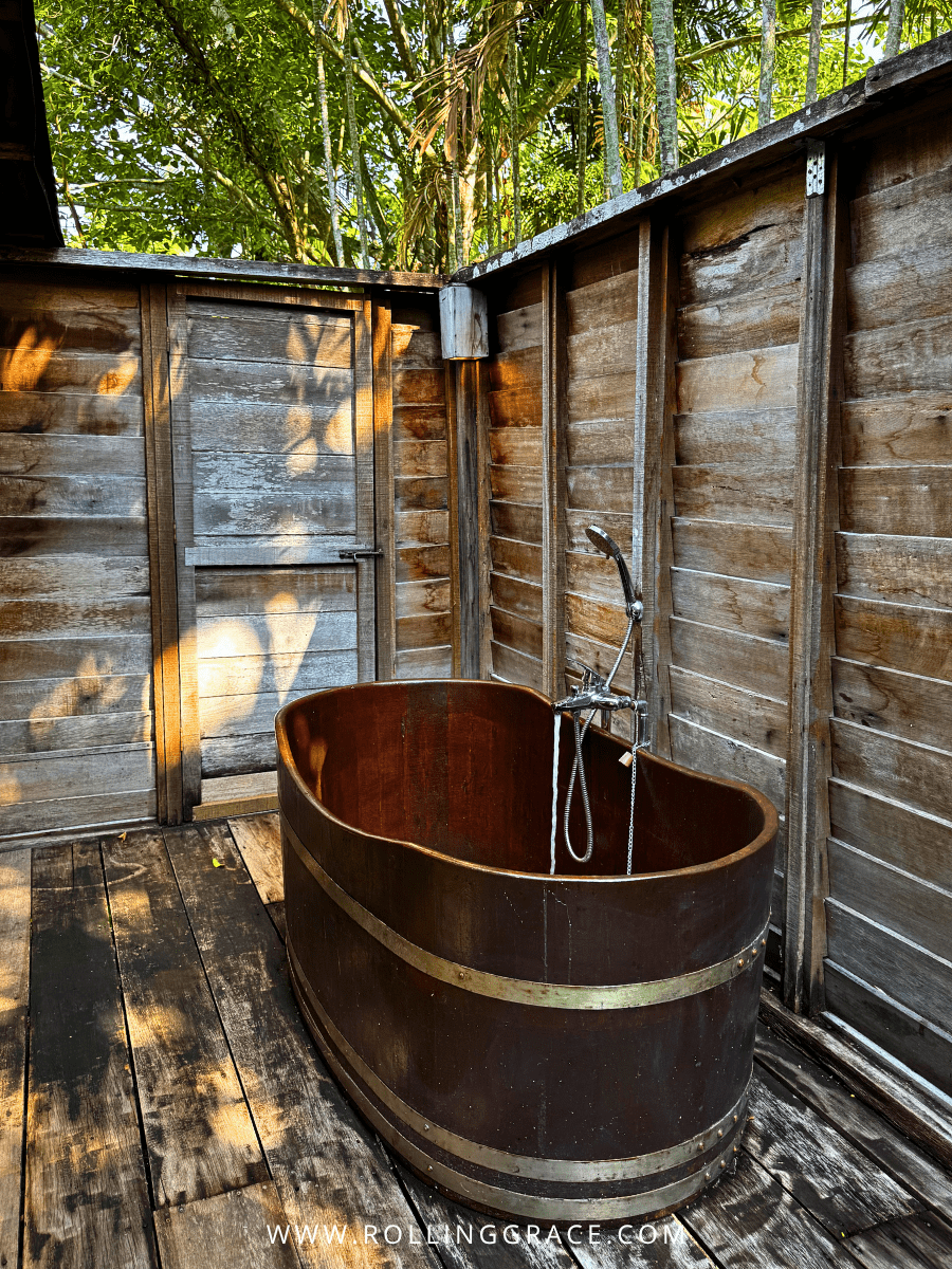 Rustic copper outdoor bathtub inside a heritage villa at Bon Ton Resort, Langkawi, Malaysia