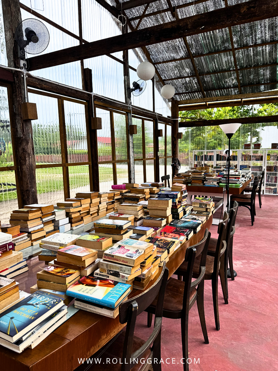 Community Library with wooden tables and natural light at Bon Ton Locale, Langkawi, Malaysia