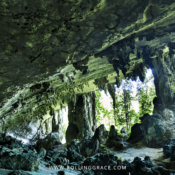 Vast limestone chamber with natural rock columns inside Gua Niah, Niah National Park, Sarawak