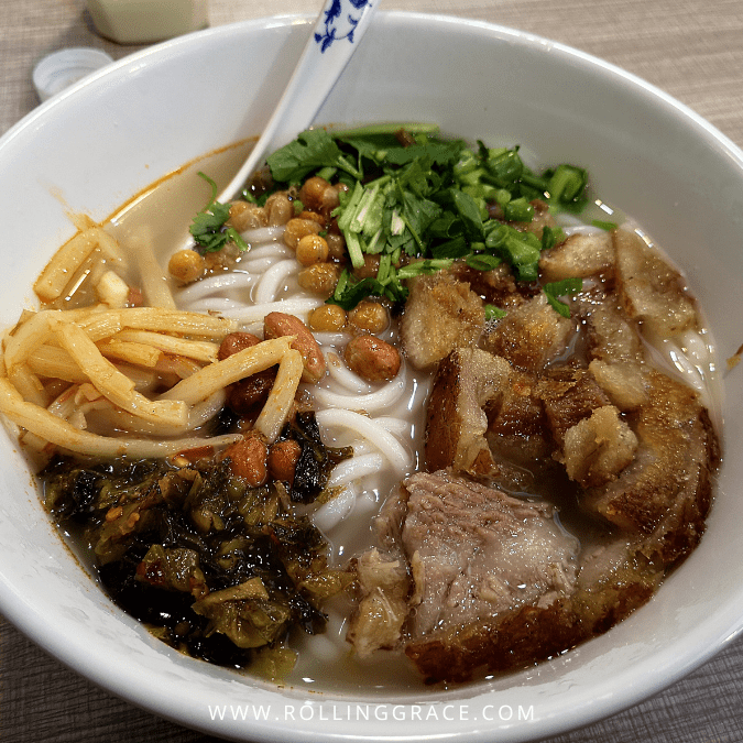 Guilin Rice Noodles in China topped with sliced pork, fried peanuts and scallions