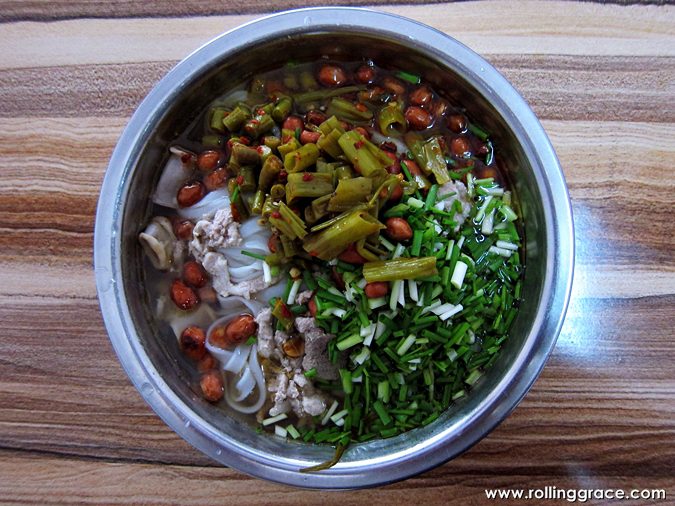 Bowl of Guilin Rice Noodles with pickled vegetables and clear broth, Guangxi, China