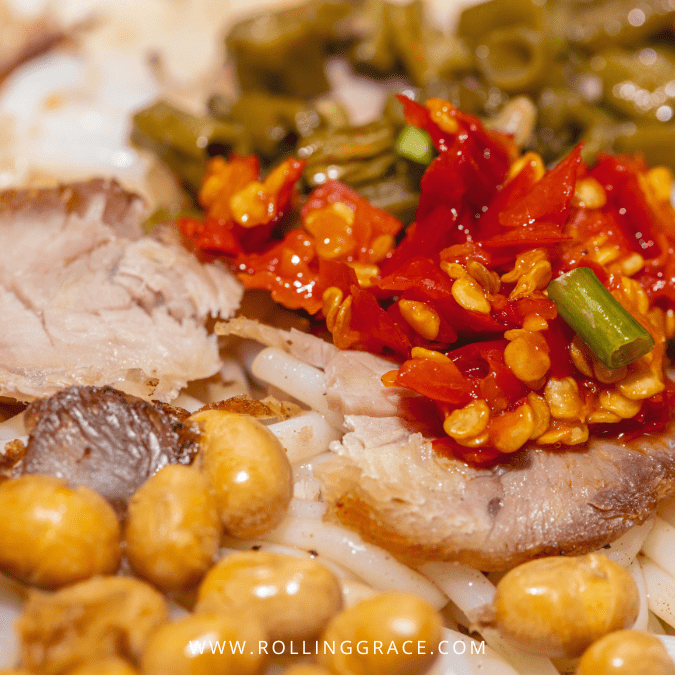 Guilin Rice Noodles recipe close-up with sliced pork, pickled chilli and quail eggs