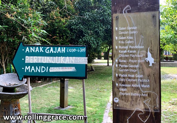 Activity signboard showing baby elephant bathing schedule at Kuala Gandah Elephant Sanctuary, Pahang