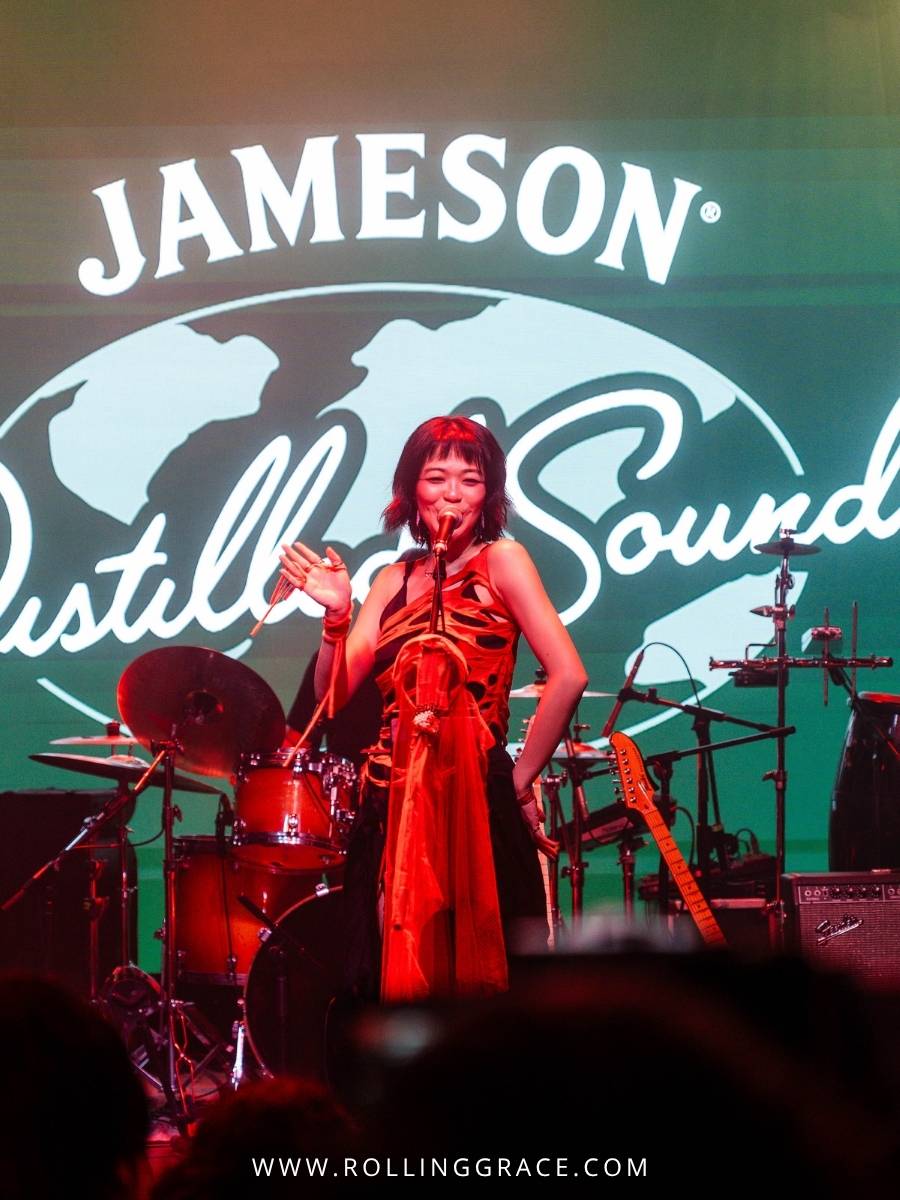 Su San performing live in red at Jameson Distilled Sounds Malaysia 2026 in Kuala Lumpur