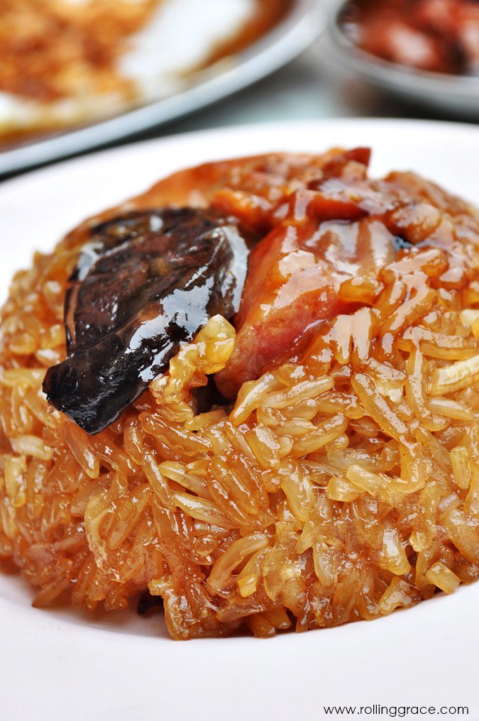 Lo mai gai glutinous rice with chicken and mushrooms steamed in lotus leaf, a Chinese dim sum Malaysian rice dish