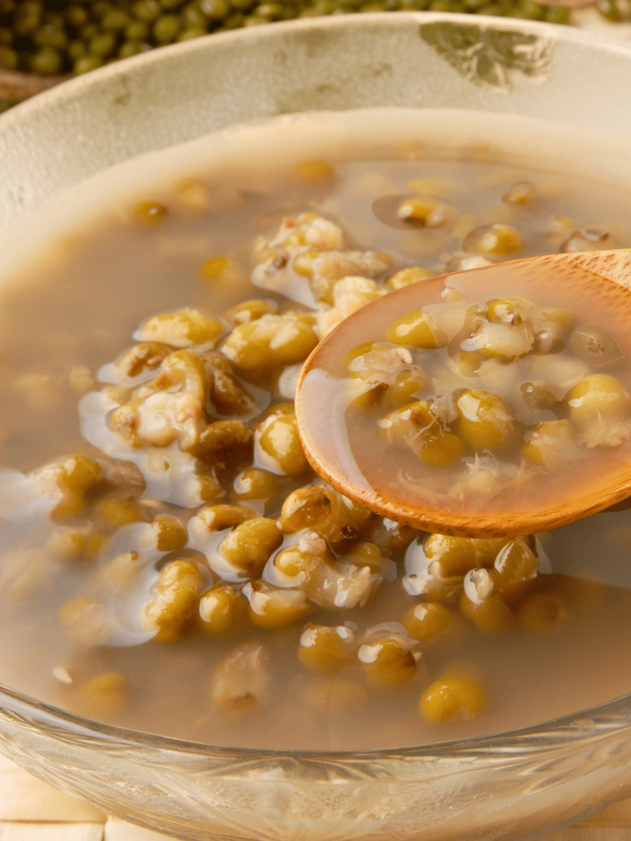Mung bean soup recipe served in a glass bowl showing individual beans in a clear sweet broth