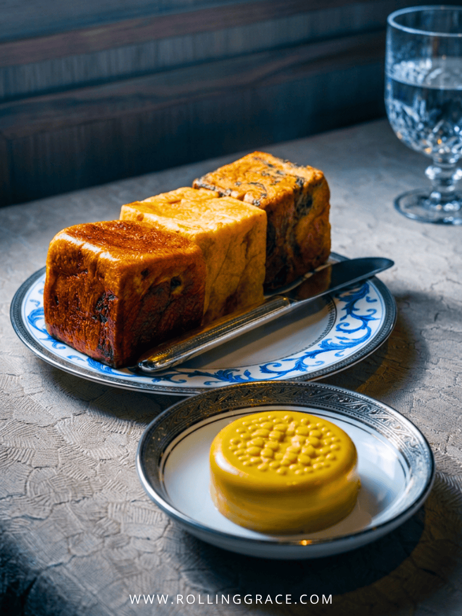 Three varieties of crusty bread with a round of whipped butter at Ortensia Shanghai