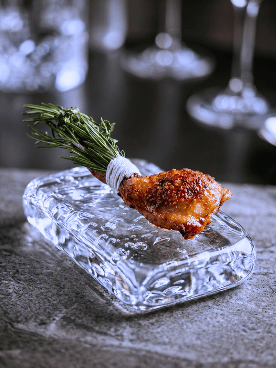 Lacquered charcoal-grilled chicken wing served on ice at Ortensia Shanghai