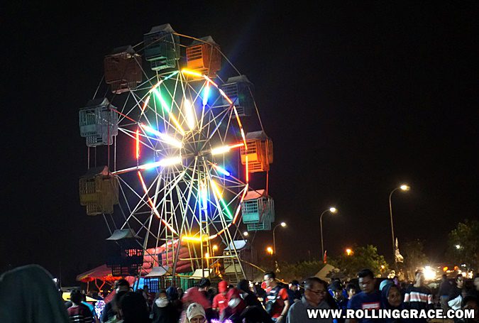 Ferris wheel lit up at night at the carnival of Pesta Angin Timur Perlis
