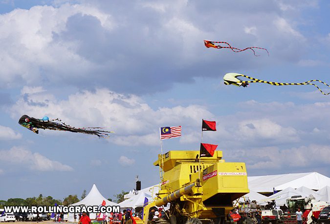 Colourful kites flying against a blue sky at Pesta Angin Timur Perlis festival