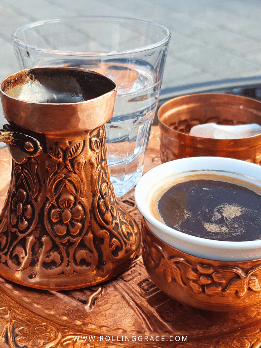 Bosnian coffee served in a copper džezva with a ceramic cup and Turkish delight