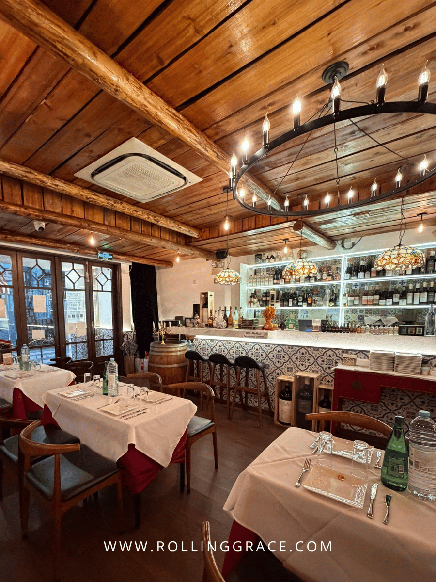 Amália Portuguese Restaurant Macau: 7 Best Dishes to Try 7 Dining room with warm lighting and wooden interior at Amália Portuguese Restaurant Macau