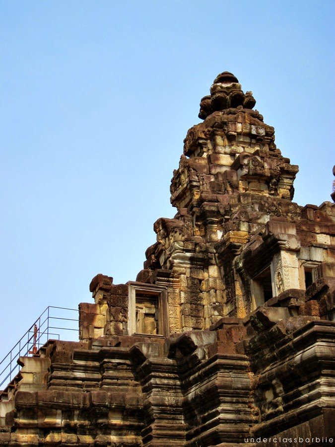 12 Best Temples in Siem Reap You Have to See 10 Baphuon Temple three-tiered sandstone pyramid rising above the treeline at Angkor Thom Siem Reap