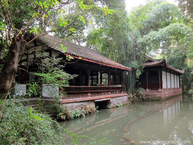 7 Stunning Things to See at Du Fu Thatched Cottage Chengdu 12 Traditional Chinese building with curved roof reflected in a pond at Du Fu Thatched Cottage Chengdu