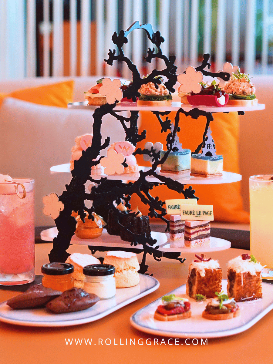 Elegant afternoon tea set with cherry blossom display at Woobar in W Kuala Lumpur for Eat Out with Marriott Bonvoy Malaysia