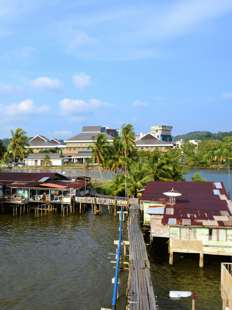 7 Best Things to Do at Kampong Ayer Brunei Water Village 3 Wooden boardwalk running between stilt houses over the Brunei River at Kampong Ayer Brunei