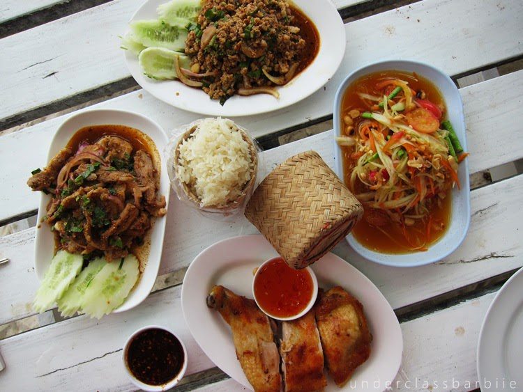 Koh Samet Thailand: 8 Best Relaxing Things to Do 8 Close-up of Thai dishes including pad thai, spring rolls, and som tum served at a restaurant on Koh Samet Thailand