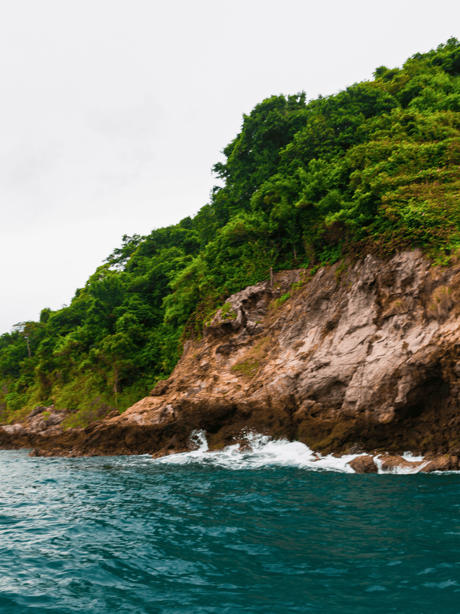 Koh Samet Thailand: 8 Best Relaxing Things to Do 15 Waves crashing against dark rocks along the eastern coast of Koh Samet Thailand