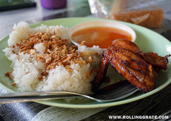 Plate of nasi ayam with grilled chicken and oily rice served at Ladang Nipah Kipli Perlis