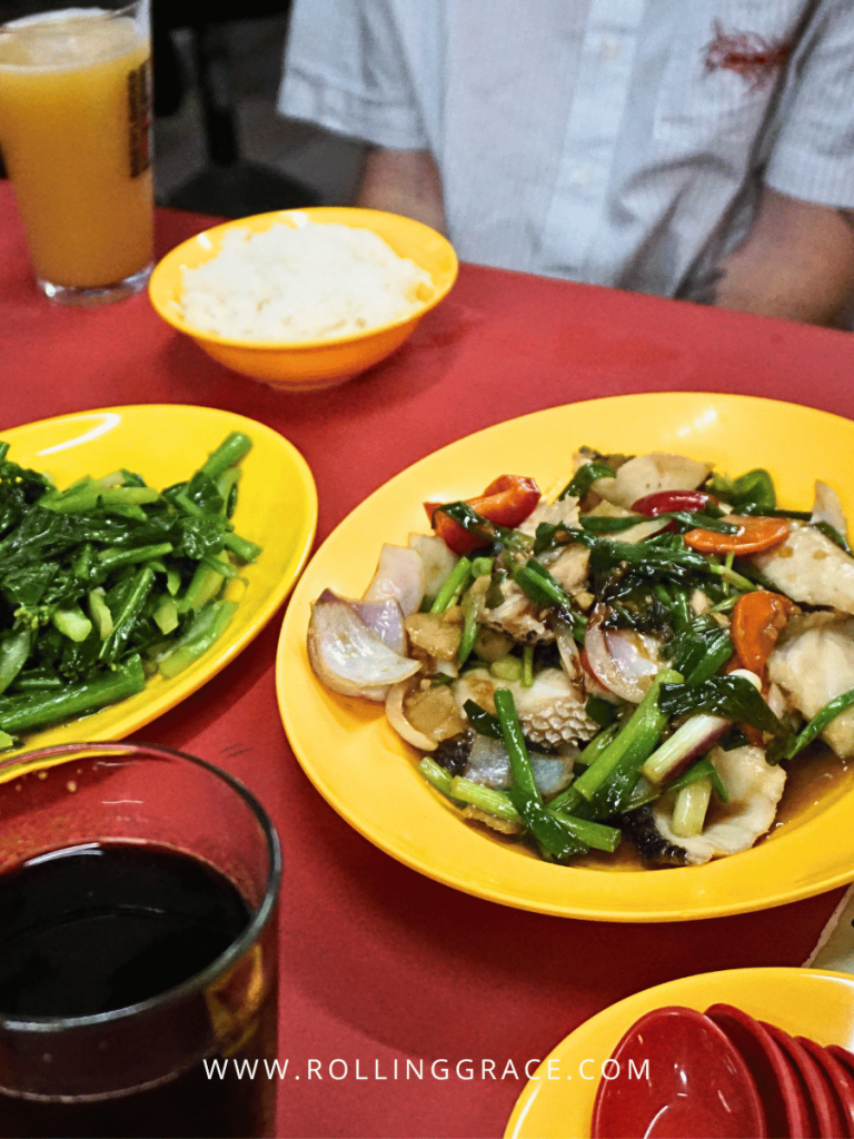 Plates of hawker food at Maxwell Food Centre near lyf Chinatown Singapore