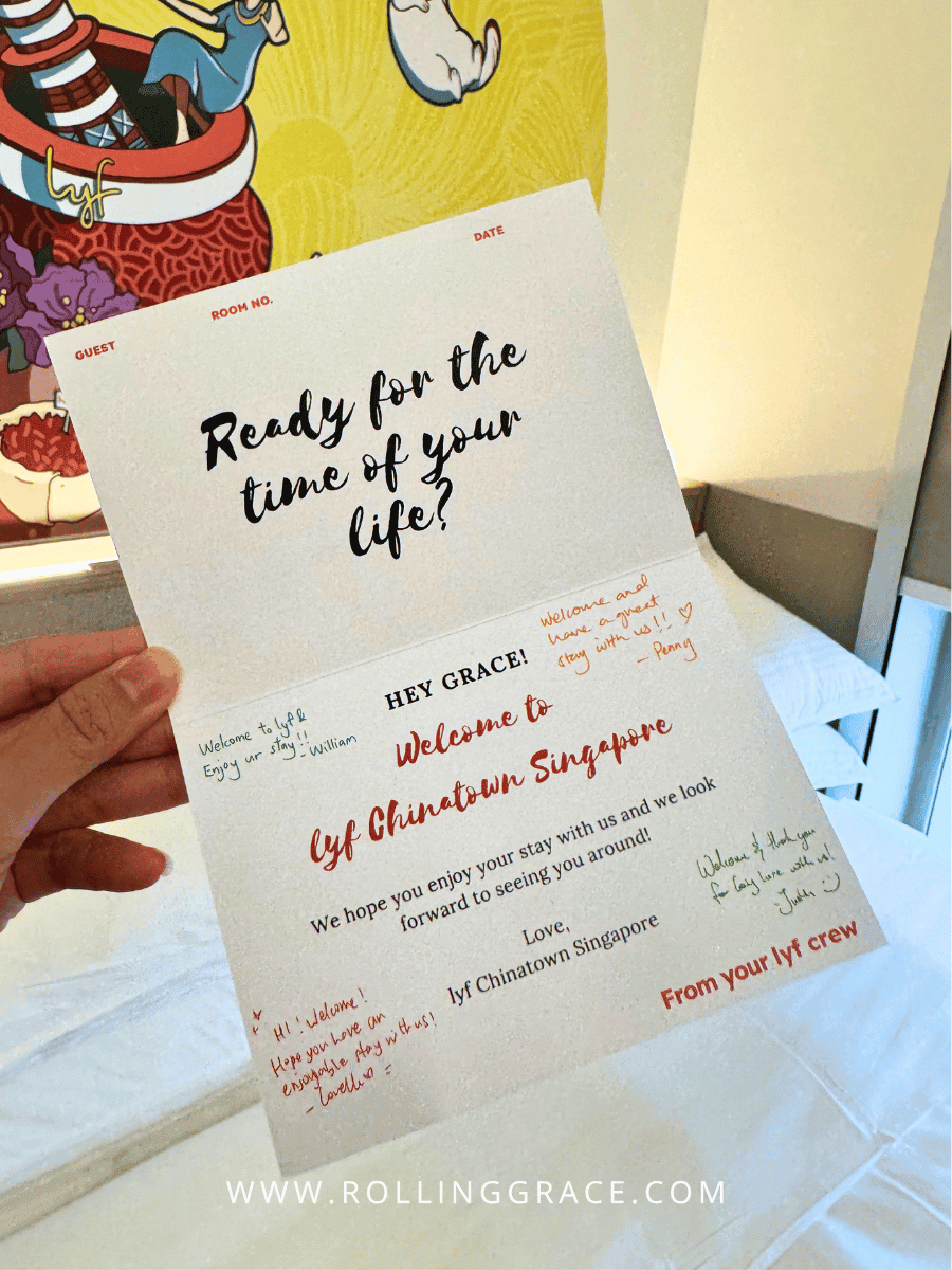 Personalised welcome card on the bed at lyf Chinatown Singapore reading Ready for the time of your life