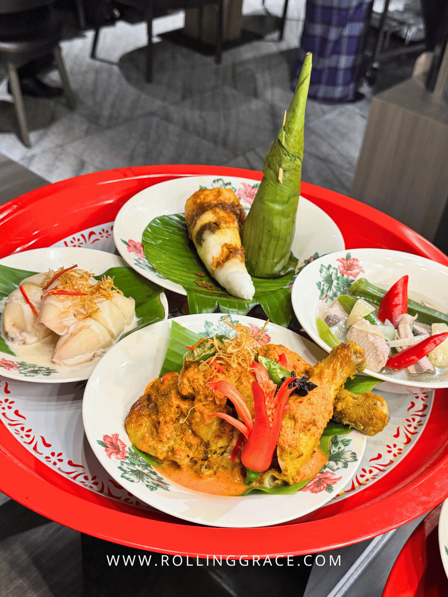 Makan Kitchen DoubleTree by Hilton: 9 Merdeka Dishes to Try 5 Red tray with prawn noodles and seafood dishes at Makan Kitchen DoubleTree by Hilton Putrajaya Lakeside Merdeka buffet