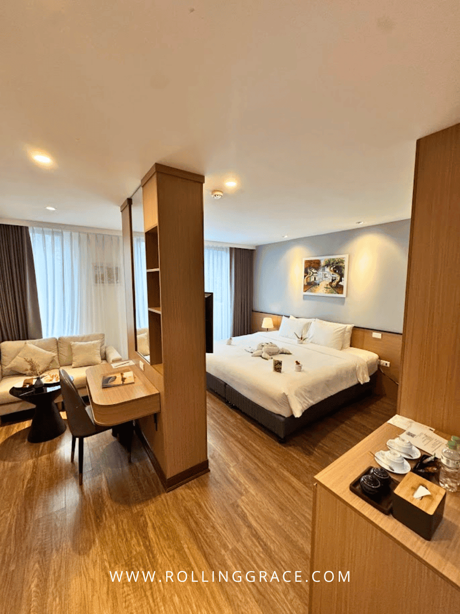 Double bed with white linens in a room at Minasi Grand Hotel Hanoi