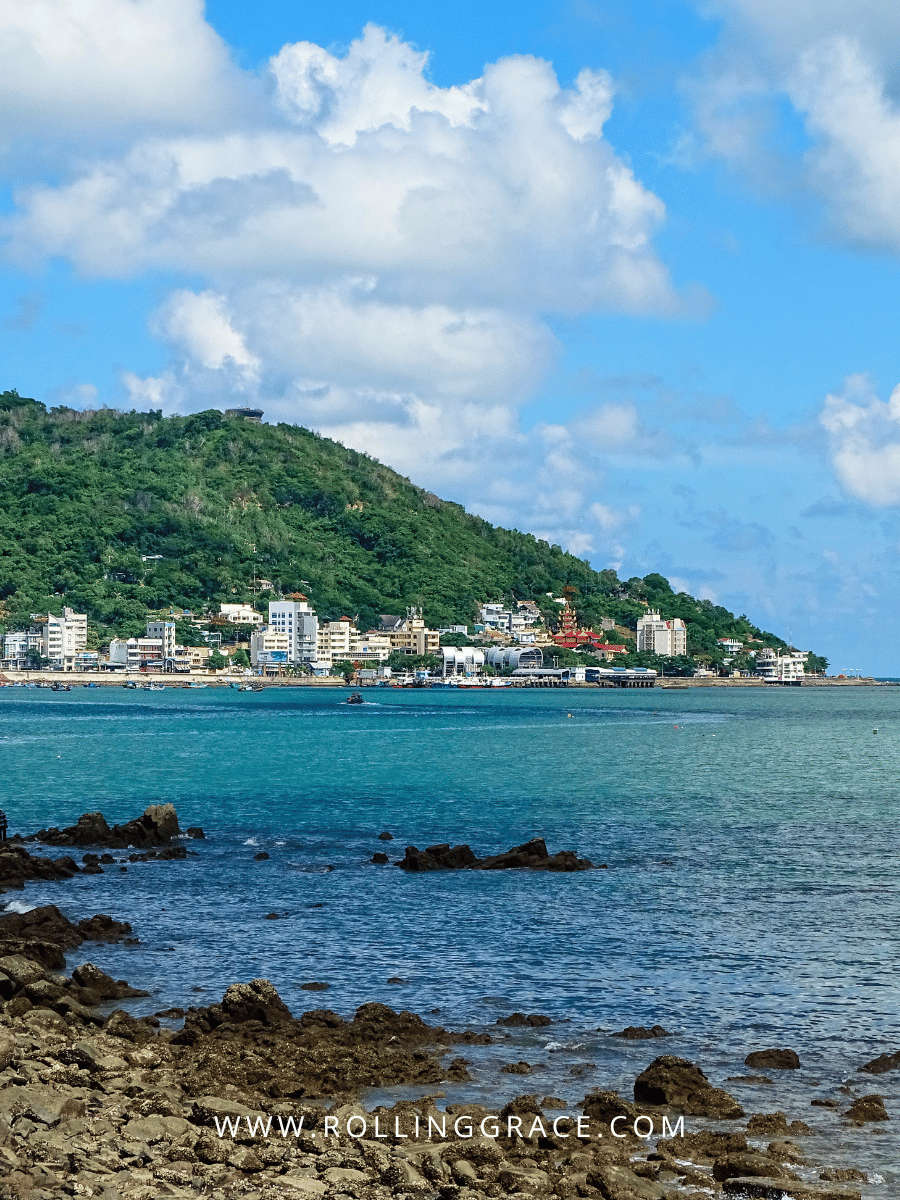 9 Best Vũng Tàu Attractions You Can't Miss in Vietnam 9 Front Beach Bãi Trước coastline with blue water and green hills in Vũng Tàu Vietnam