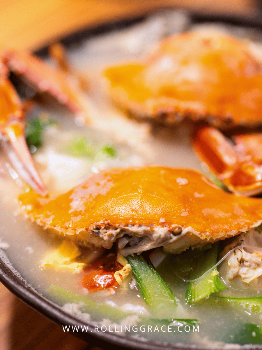 What to Eat in Macau: 10 Best Macanese Food to Try 12 Bowl of crab congee topped with fried egg and fresh crab in Macau