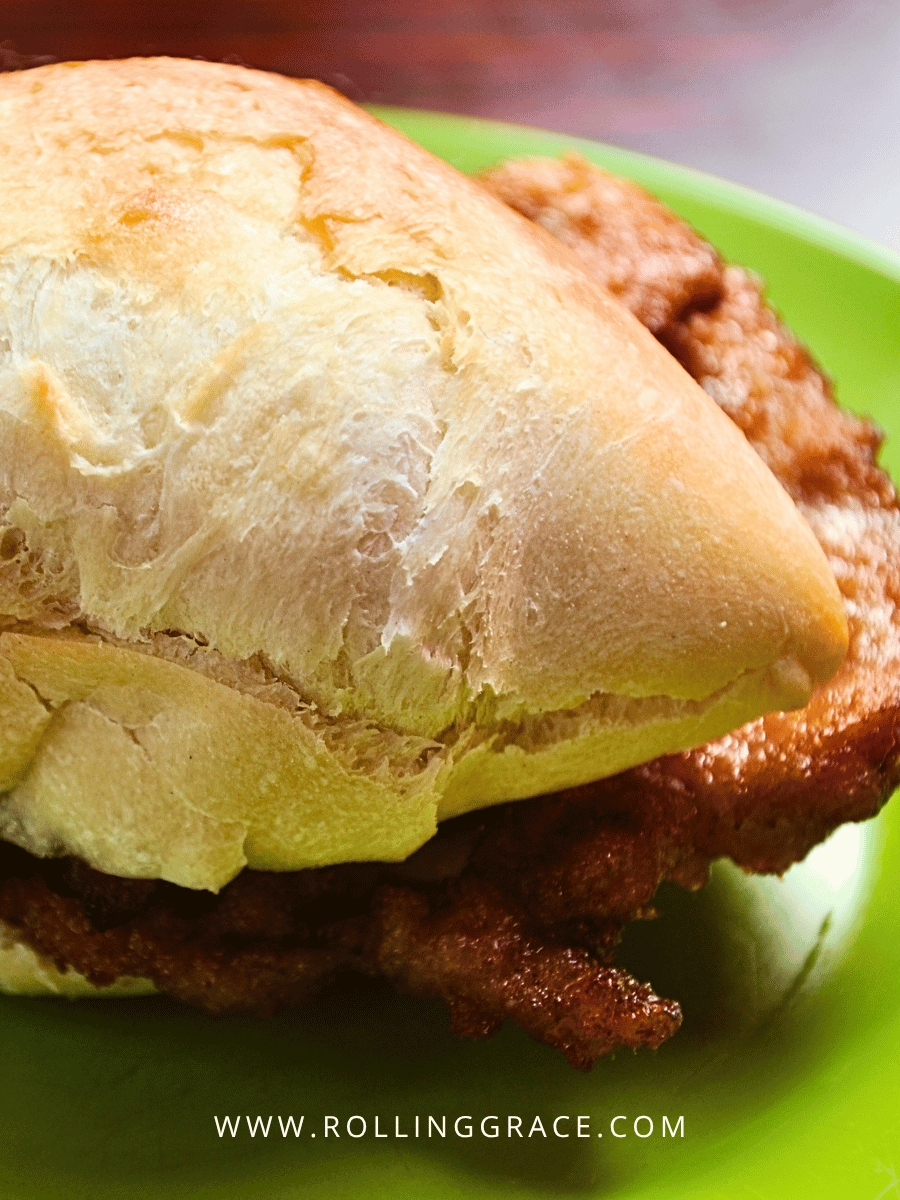 What to Eat in Macau: 10 Best Macanese Food to Try 9 Macau pork chop bun with thick marinated pork in a crispy baguette roll
