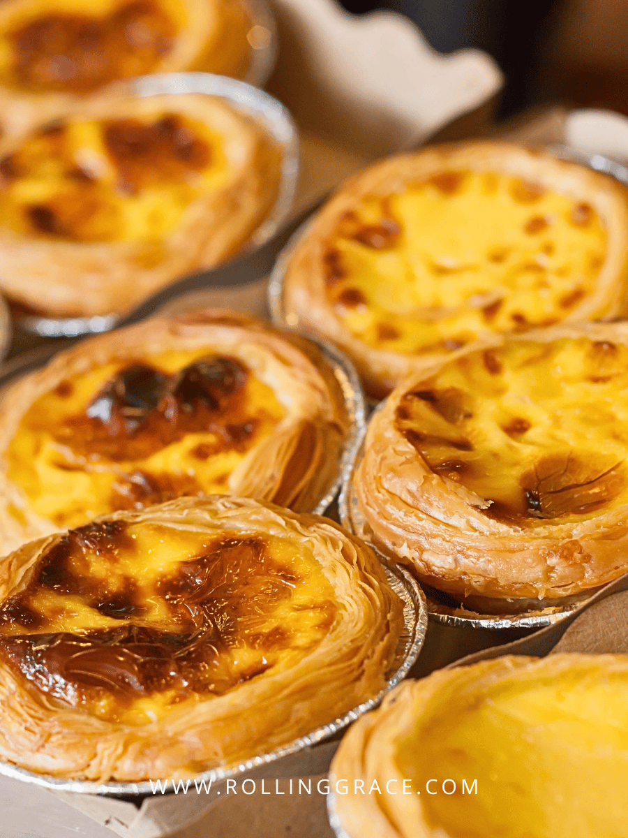 What to Eat in Macau: 10 Best Macanese Food to Try 8 Close-up of caramelised Portuguese egg tarts with blistered tops in Macau