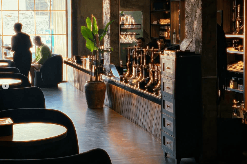 12 Best Shisha in Bali: Hookah in Canggu, Seminyak & Ubud 13 Warm interior lounge with ambient lighting at Eden Hookah Club Uluwatu, a top pick for best shisha in Bali by Rolling Grace