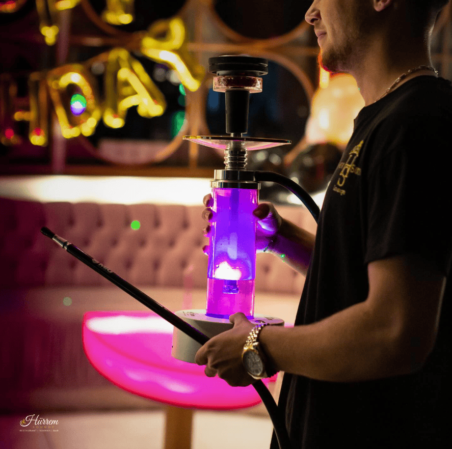 Hürrem Sultan Lounge Kreuzberg Berlin with glowing hookah pipe and Ottoman-themed pink interior