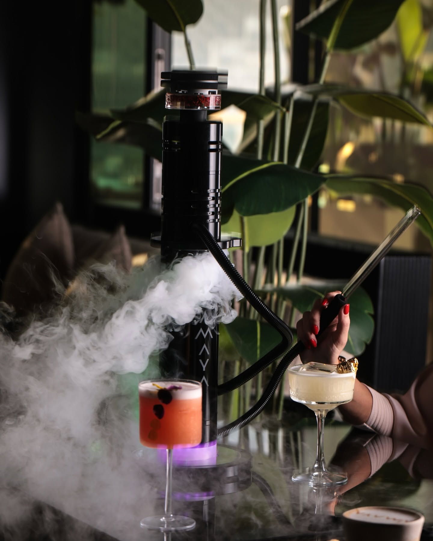 Amaya Dubai Mall hookah lounge with premium shisha pipe and moody ambient lighting