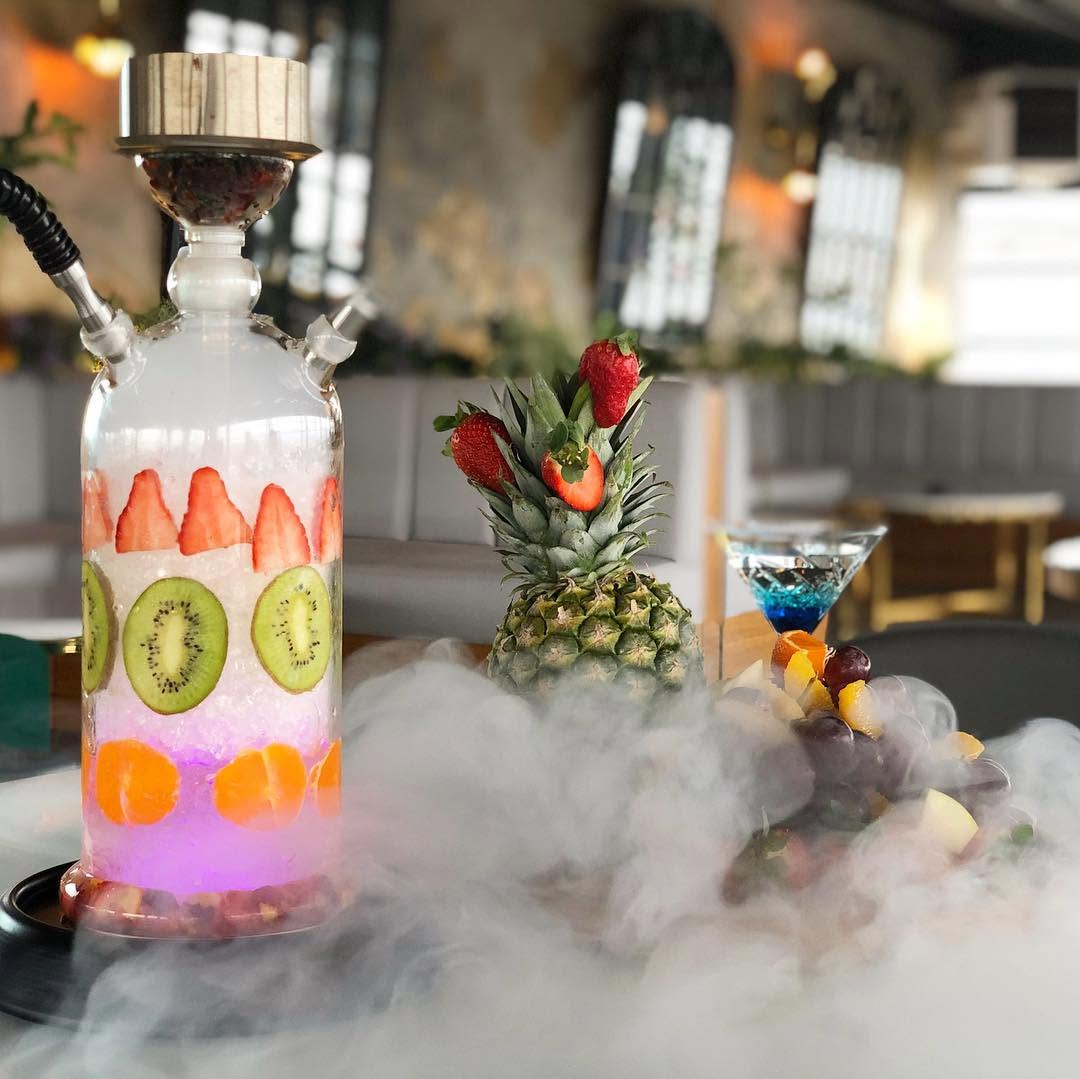 Best Shisha in Istanbul, Turkey: 10 Amazing Nargile to Try 3 Colourful hookah setup with fresh fruit cocktails at Lotiz Lounge and Hookah in Istanbul