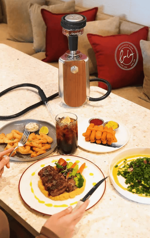 Best Shisha in Istanbul, Turkey: 10 Amazing Nargile to Try 8 Brunch spread with pastries and a red hookah pipe at Lulu Hookah Lounge overlooking the Bosphorus in Istanbul