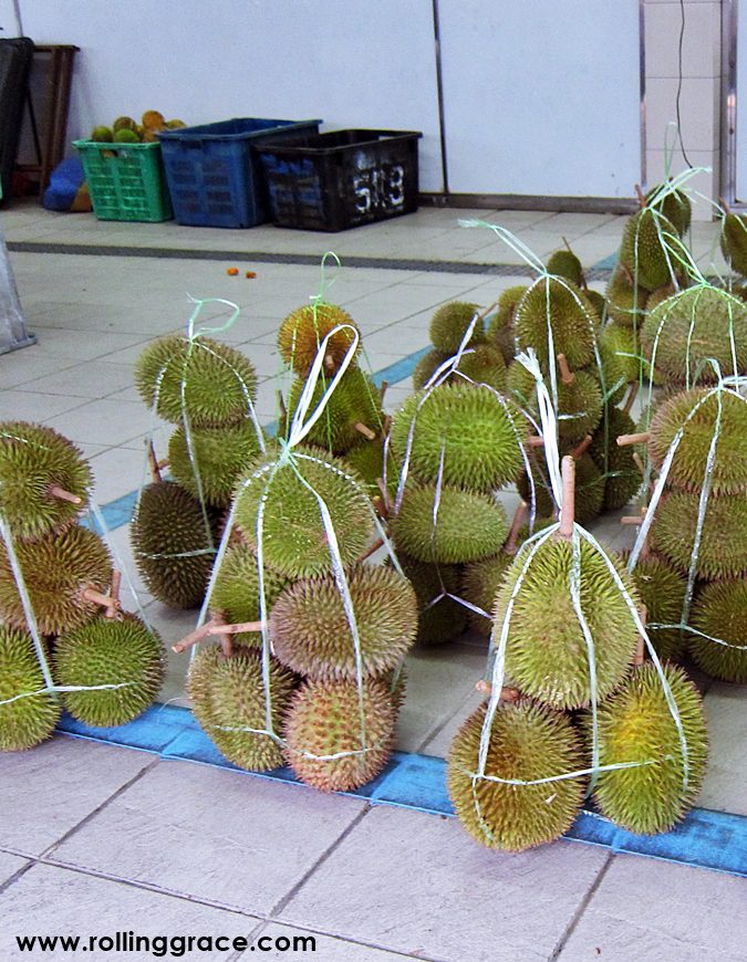 Packaged red durian in Borneo fruits in plastic containers at a tamu market in Sabah