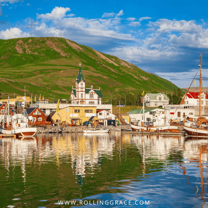 Colourful harbour town with mountains in the background in Iceland the safest country for solo female travel